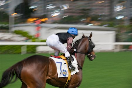 Horse racing in Happy Valley race course, Hong Kong Fotografie stock - Rights-Managed, Codice: 855-05980990