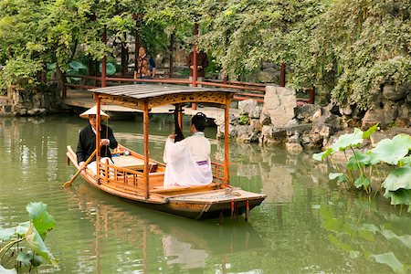 A woman playing pipa on a boat at the garden to Liuyuan, Suzhou, Jiangsu Province, China Foto de stock - Con derechos protegidos, Código: 855-05982277