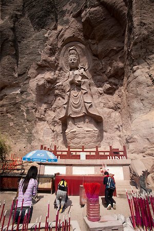 Rock carving of Buddha at the cave shrine, Roaring tiger rock Huxiaoyan, Yixiantian, Wuyi mountains, Fujian, China Stock Photo - Rights-Managed, Code: 855-05982404