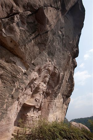 Rock carving of Buddha at the cave shrine, Roaring tiger rock Huxiaoyan, Yixiantian, Wuyi mountains, Fujian, China Stock Photo - Rights-Managed, Code: 855-05982402