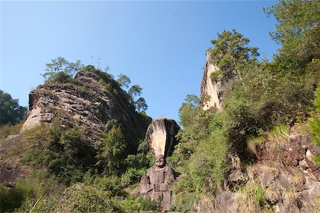 Rock sculpture of laughing buddha at Dahongpao, Wuyi mountains, Fujian, China Stock Photo - Rights-Managed, Code: 855-05982447