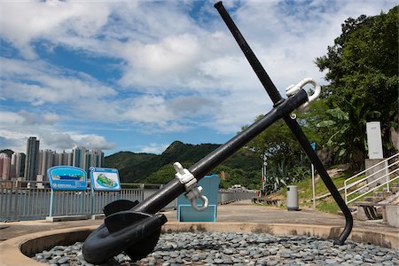 An anchor displayed at Hong Kong Museum of Coastal Defence with the Lei Yu Mun skyline in the distance, Hong Kong Stock Photo - Rights-Managed, Code: 855-05983831