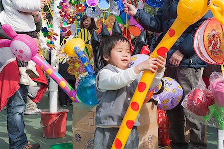 Boys playing with the balloons at the fllower market, Tsuen Wan, Hong Kong Stock Photo - Rights-Managed, Code: 855-06314079