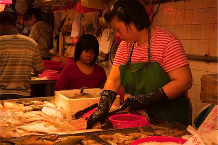 Fish seller at the red market, Macau Stock Photo - Rights-Managed, Code: 855-06312492