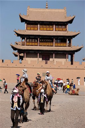 Tourists riding on camel at Fort of Jiayuguan Great Wall, Jiayuguan, Silkroad, China Stock Photo - Rights-Managed, Code: 855-06312749