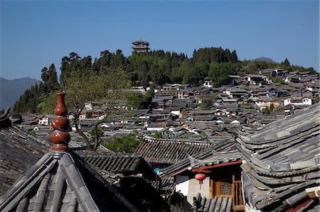 simsearch:855-05982637,k - Ancient residential rooftops and Wan Gu Lou in the distance, Old town of Lijiang, Yunnan Province, China Stock Photo - Rights-Managed, Code: 855-06313084