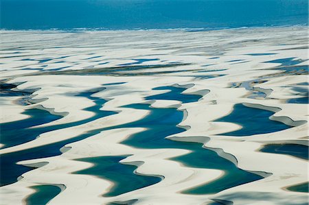 Sandy dunes and lagoons, part of Parque Nacional dos Lencois Maranhenses, Brazil Stock Photo - Rights-Managed, Code: 855-06313098