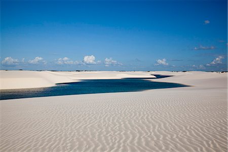 Sandy dunes near Lagoa Bonita (Beautiful Lagoon) at Parque Nacional dos Lencois Maranhenses, Brazil Stock Photo - Rights-Managed, Code: 855-06313113