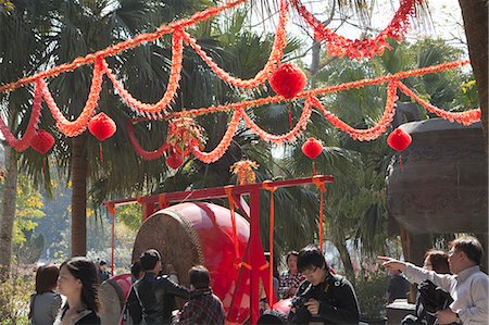 People beating drum for a wish during the Chinese New Year at Po Lin Monastery, Lantau Island, Hong Kong Fotografie stock - Rights-Managed, Codice: 855-06313718