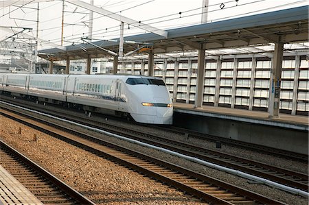 A bullet train passes Hemeji Station, Hyogo Prefecture, Japan Stock Photo - Rights-Managed, Code: 855-06337578