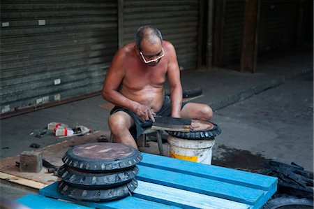 A repairer at the fresh fruits wholesale market, Yau Ma Tei, Hong Kong Stock Photo - Rights-Managed, Code: 855-06337626