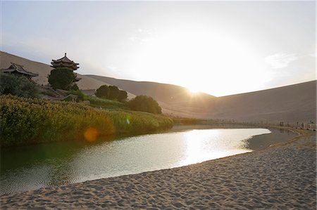 desert lake - Sunset over Yueyaquan (Crescent moon lake), Mingsha Shan, Dunhuang, Silkroad, Gansu Province, China Stock Photo - Rights-Managed, Code: 855-06337765