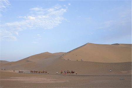 simsearch:855-06337903,k - Camel riding on Dunes at Mingsha Shan, Dunhuang, Silkroad, Gansu Province, China Stock Photo - Rights-Managed, Code: 855-06337770