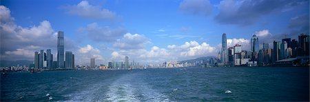 Panoramic skyline of Hong Kong island and Kowloon in Victoria Harbour, Hong Kong Stock Photo - Rights-Managed, Code: 855-06339417