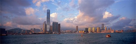 Panoramique skyline de Kowloon dans le port de Victoria à la nuit tombante, Hong Kong Photographie de stock - Rights-Managed, Code: 855-06339424