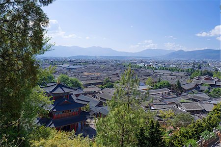 Tiled roof of Naxi's folk house view from Mu family's mansion(Mu Fu), , Old city of Lijiang, Yunnan Province, PRC Stock Photo - Rights-Managed, Code: 855-08420710