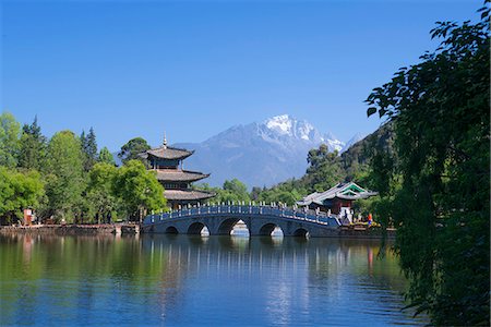 Jade dragon snow mountain(Yulongxueshan) view from Black dragon pool(Heilongtan), Old city of Lijiang, Yunnan Province, PRC Stock Photo - Rights-Managed, Code: 855-08420722