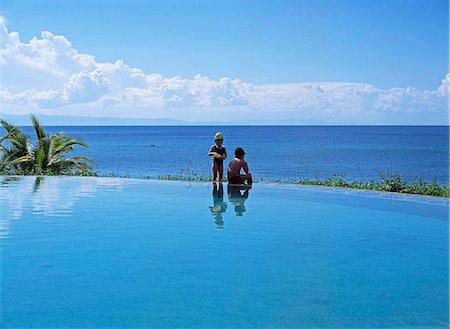 A father and son at poolside Fotografie stock - Rights-Managed, Codice: 855-02987598