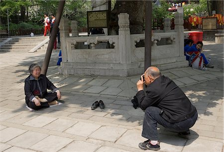 senior couple sight seeing - Senior couples photographing at Tanzhesi Temple, Beijing environs, China Stock Photo - Rights-Managed, Code: 855-02989193