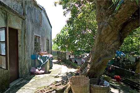 Village houses in Yung Shu Wan,Lamma Island,Hong Kong Fotografie stock - Rights-Managed, Codice: 855-03024117