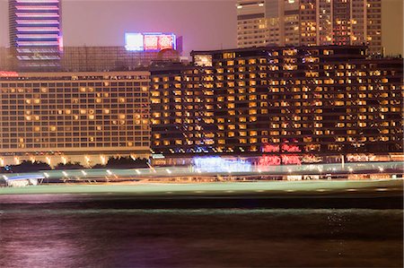 simsearch:855-03024104,k - Ship crossing harbour towards the Tsim Sha Tsui East,Kowloon,Hong Kong Stock Photo - Rights-Managed, Code: 855-03024148