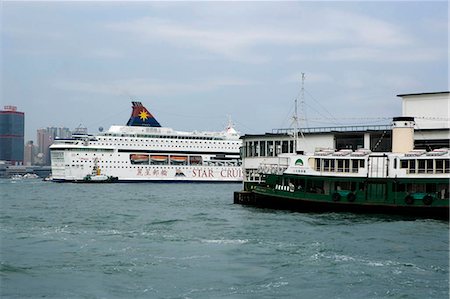 A cruise ship by the Star Ferry Pier in Victoria Harbour,Hong Kong Stock Photo - Rights-Managed, Code: 855-03024461