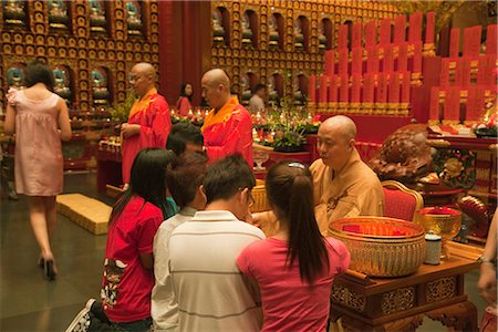 simsearch:855-03025298,k - Monk giving blessing at Buddha Tooth Relic Temple and Museum,Chinatown,Singapore Stock Photo - Rights-Managed, Code: 855-03025299