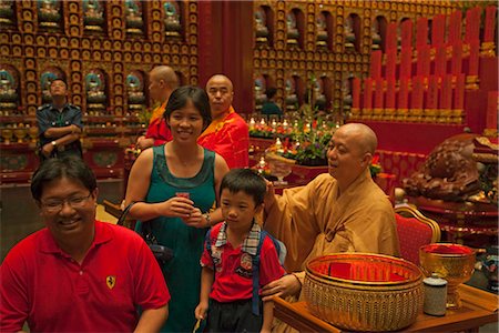 Monk giving blessing at Buddha Tooth Relic Temple and Museum,Chinatown,Singapore Stock Photo - Rights-Managed, Code: 855-03025292