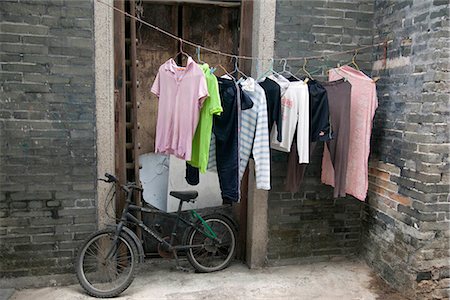 simsearch:855-03022531,k - Laundry hoisting outside an old residence,Nam Bin Wei village,Yuen Long,Hong Kong Stock Photo - Rights-Managed, Code: 855-03025570