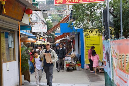 People on the main street of Yung Shu Wan,Lamma Island,Hong Kong Fotografie stock - Rights-Managed, Codice: 855-03021889