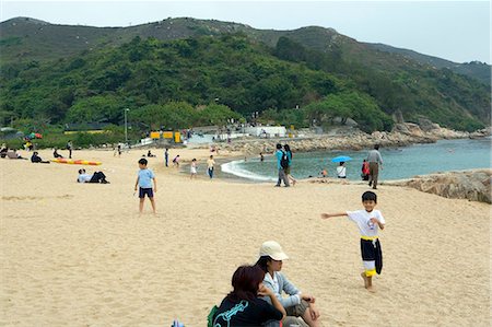 People relaxing at Hung Sing Ye Beach,Lamma Island,Hong Kong Fotografie stock - Rights-Managed, Codice: 855-03021882