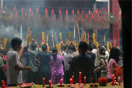 simsearch:855-03022387,k - Devotee at Chua Ba Thien Hau,Nguyen Trai St,during the Chinese New Year,Ho Chi Minh City,Vietnam Stock Photo - Rights-Managed, Code: 855-03021967