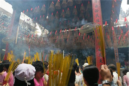 simsearch:855-03025298,k - Devotee at Chua Ba Thien Hau,Nguyen Trai St,during the Chinese New Year,Ho Chi Minh City,Vietnam Stock Photo - Rights-Managed, Code: 855-03021968