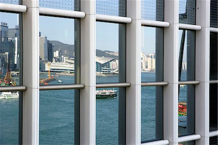 Réflexion sur la fenêtre 2IFC du Star Ferry et du Centre de Convention, Hong Kong Photographie de stock - Rights-Managed, Code: 855-03022479