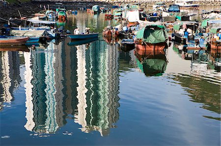 simsearch:855-06312664,k - Reflection of highrise condominium contrasting to the old fishing village at Lei Yu Mun,Hong Kong Stock Photo - Rights-Managed, Code: 855-03023658