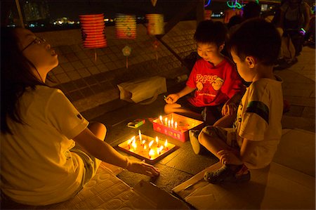 Children celebrating the Mid-Autumn Festival at Quarry Bay Park,Hong Kong Stock Photo - Rights-Managed, Code: 855-03023736