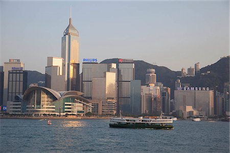 Wanchai skyline from Kowloon with a star ferry in foreground, Hong Kong Fotografie stock - Rights-Managed, Codice: 855-03252860