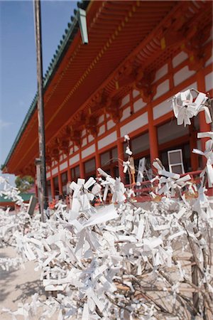 Omikujii (fortune slip) tying at Heian-jingu shrine, Kyoto, Japan Stock Photo - Rights-Managed, Code: 855-03253073