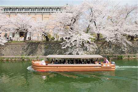 Tour boat on river with cherry blossom along the river bank, Okazaki, Kyoto, Japan Stock Photo - Rights-Managed, Code: 855-03253083