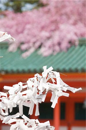 Omikujii (fortune slip) tying at Heian-jingu shrine, Kyoto, Japan Stock Photo - Rights-Managed, Code: 855-03253102