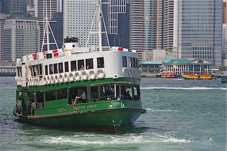 simsearch:855-03022621,k - Star ferry in Victoria Harbour with skyscrapers in the background, Hong Kong Stock Photo - Rights-Managed, Code: 855-03253443