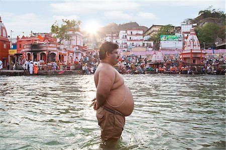 pilgrimage - Profile of an obese man standing in River Ganges, Har Ki Pauri, Haridwar, Uttarakhand, India Stock Photo - Rights-Managed, Code: 857-06721455