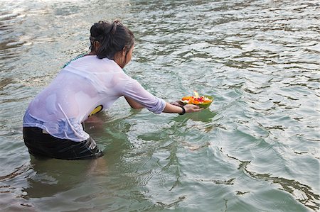 Woman taking holy dip and performing rituals in River Ganges, Haridwar, Uttarakhand, India Stock Photo - Rights-Managed, Code: 857-06721458