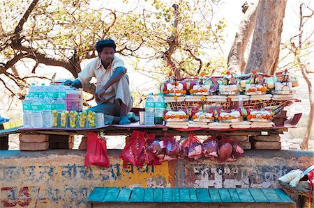 Man selling religious offering and water bottles, Haridwar, Uttarakhand, India Stock Photo - Rights-Managed, Code: 857-06721469