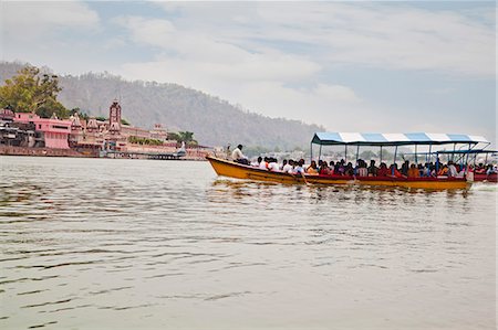 People traveling on boat in Ganges River, Rishikesh, Uttarakhand, India Stock Photo - Rights-Managed, Code: 857-06721500