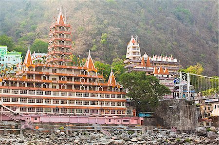 rishikesh - Facade of a multi-storied temple at the riverside, Trayambakeswar Temple, Lakshman Jhula, River Ganges, Rishikesh, Dehradun District, Uttarakhand, India Stockbilder - Lizenzpflichtiges, Bildnummer: 857-06721515