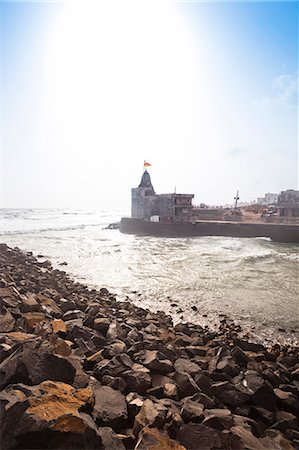 Temple and buildings at the waterfront, Gomati River, Dwarka, Gujarat, India Photographie de stock - Rights-Managed, Code: 857-06721696