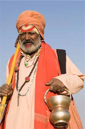 Close-up of a sadhu holding a kamandal, Pushkar, Rajasthan, India Stock Photo - Rights-Managed, Code: 857-03192474