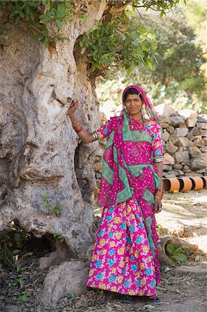 Woman standing near a tree, Kumbhalgarh, Udaipur, Rajasthan, India Stock Photo - Rights-Managed, Code: 857-03192515