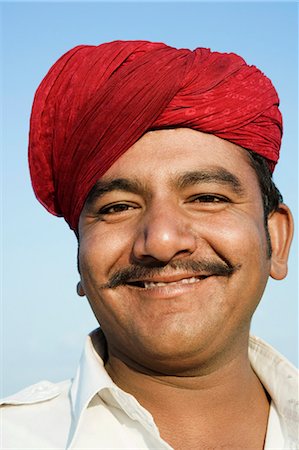 smiling indian mustache - Portrait d'un jeune homme souriant, Jaisalmer, Rajasthan, Inde Photographie de stock - Rights-Managed, Code: 857-03192643